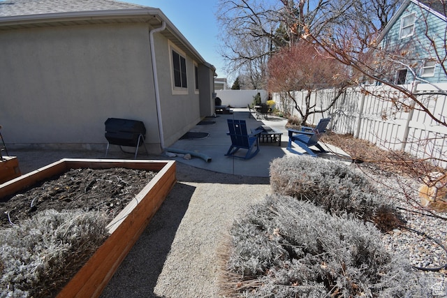 1689 E Kierstin Pl, Salt Lake City, UT 84108 - view of yard featuring a patio, a garden, and a fenced backyard