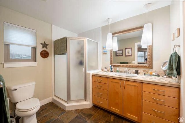 1689 E Kierstin Pl, Salt Lake City, UT 84108 - full bath featuring baseboards, toilet, a stall shower, stone finish floor, and vanity