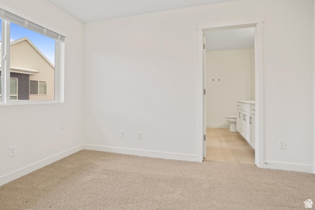67 E Hamblin Ln, Clearfield, UT 84015 - spare room featuring light colored carpet and baseboards