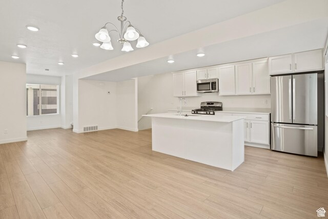 67 E Hamblin Ln, Clearfield, UT 84015 - kitchen with appliances with stainless steel finishes, light countertops, white cabinetry, a sink, and recessed lighting