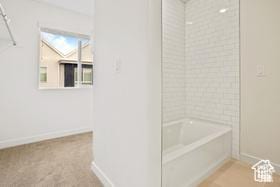67 E Hamblin Ln, Clearfield, UT 84015 - bathroom with baseboards and shower / bathtub combination