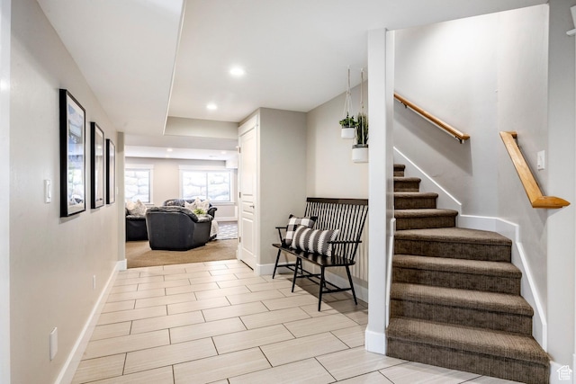 interior space featuring baseboards and recessed lighting