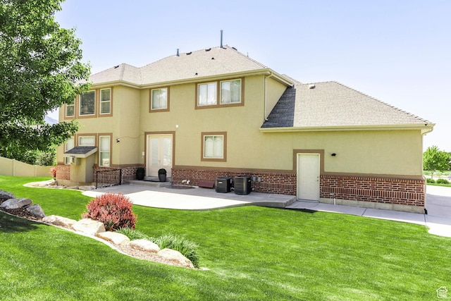 6302 Lone Rock Rd, Highland, UT 84003 - back of property with stucco siding, a patio area, central AC, and brick siding