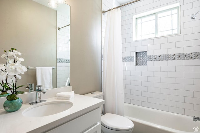 full bath with vanity, shower / bathtub combination with curtain, and toilet