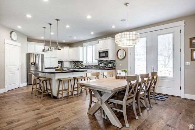 6302 Lone Rock Rd, Highland, UT 84003 - dining area with wood-type flooring, recessed lighting, and baseboards