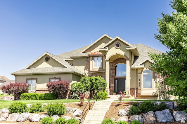 6302 Lone Rock Rd, Highland, UT 84003 - view of front of house with stucco siding, brick siding, and stone siding