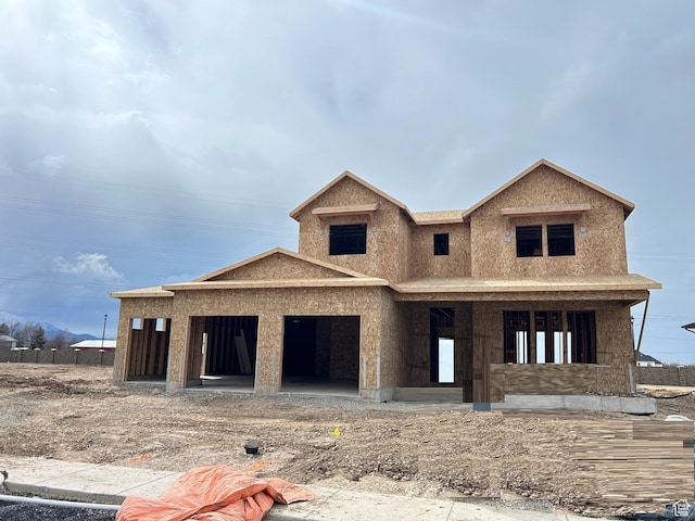 unfinished property with an attached garage