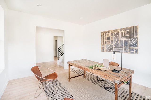 office area with light wood finished floors and baseboards