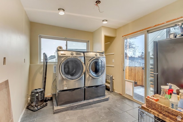 6259 S 340 E, Murray, UT 84107 - laundry room with tile patterned flooring, laundry area, independent washer and dryer, and a wealth of natural light