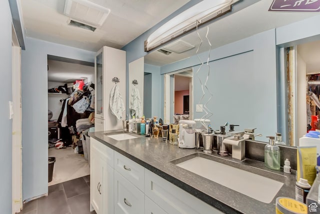 6259 S 340 E, Murray, UT 84107 - bathroom with a sink, double vanity, a spacious closet, and tile patterned flooring
