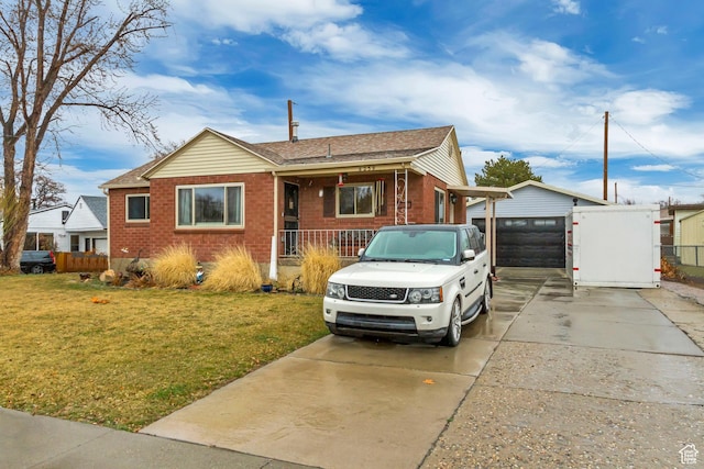 6259 S 340 E, Murray, UT 84107 - view of front of property featuring a front lawn, fence, brick siding, and driveway