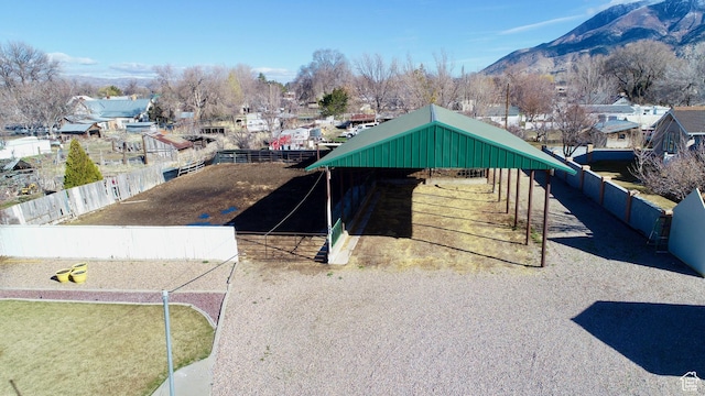 exterior space featuring an outbuilding, a mountain view, and an exterior structure