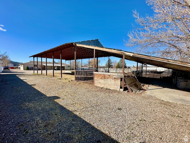 view of yard featuring an outbuilding and an exterior structure
