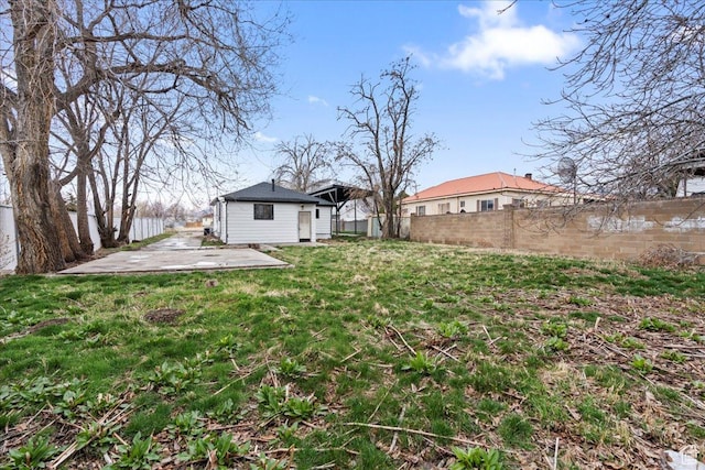 555 N 100 W, Tooele, UT 84074 - view of yard featuring an outdoor structure and fence