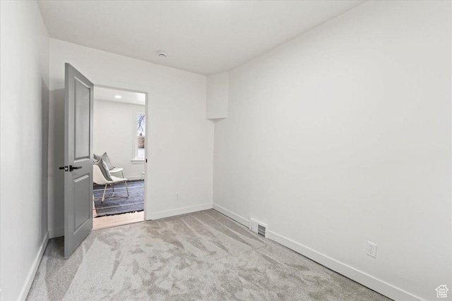 555 N 100 W, Tooele, UT 84074 - spare room with carpet, visible vents, and baseboards