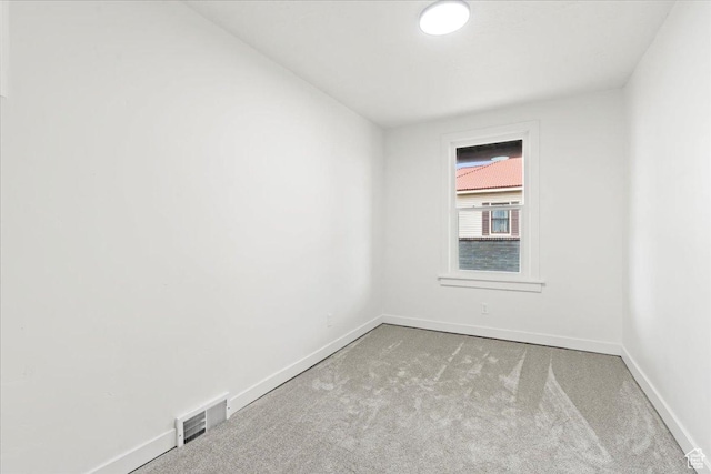 555 N 100 W, Tooele, UT 84074 - carpeted spare room featuring visible vents and baseboards