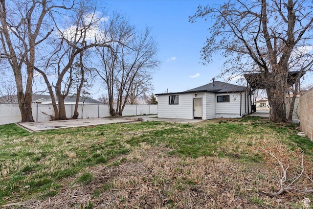 555 N 100 W, Tooele, UT 84074 - rear view of property featuring a yard, a patio, and a fenced backyard