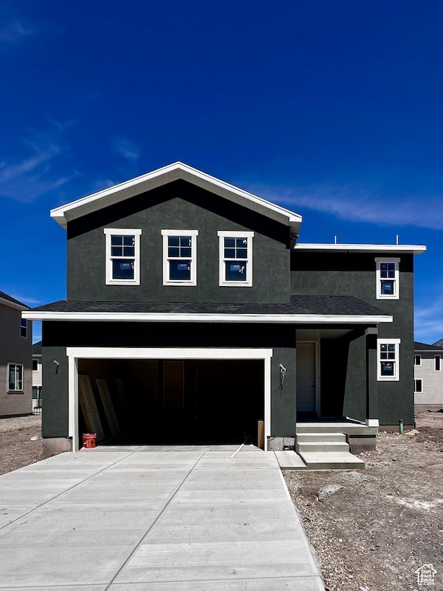 1114 W 450 S Unit 62, Brigham City, UT 84302 - view of front of property with stucco siding, driveway, and a garage