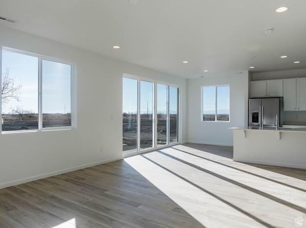 1114 W 450 S Unit 62, Brigham City, UT 84302 - unfurnished living room featuring recessed lighting, baseboards, and light wood-type flooring