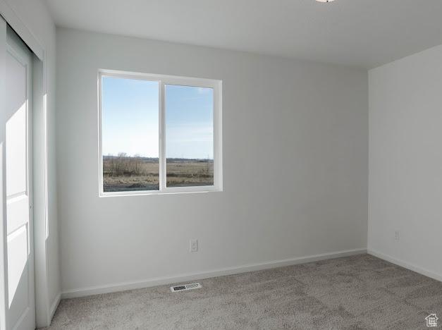 1114 W 450 S Unit 62, Brigham City, UT 84302 - empty room with carpet and baseboards