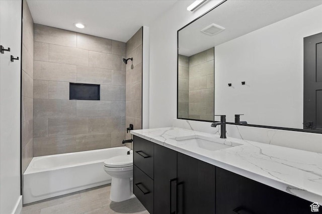 bathroom featuring shower / bath combination, toilet, visible vents, and vanity