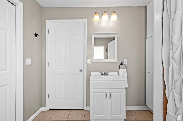 1065 E 900 S, Pleasant Grove, UT 84062 - bathroom featuring tile patterned flooring, vanity, and baseboards