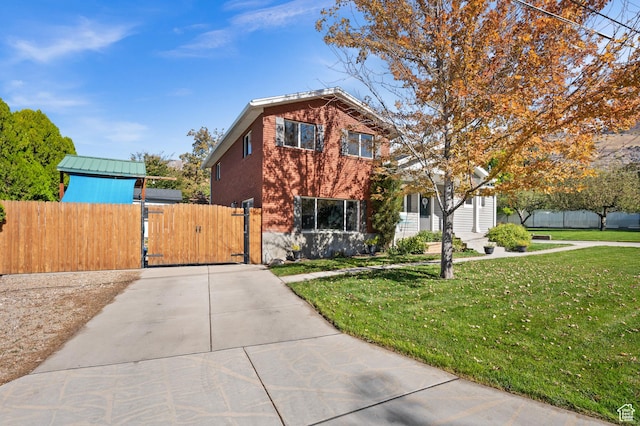 1065 E 900 S, Pleasant Grove, UT 84062 - view of front of property with brick siding, fence, a front yard, and a gate
