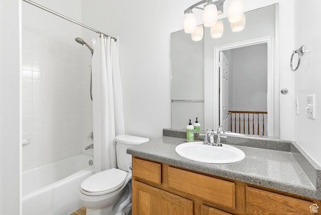 bathroom featuring a notable chandelier, shower / bath combination with curtain, toilet, and vanity