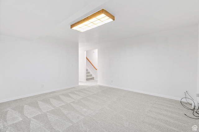 interior space featuring stairs, baseboards, and carpet floors