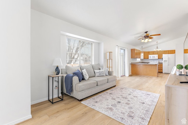 living room with baseboards, light wood-style floors, vaulted ceiling, and ceiling fan with notable chandelier