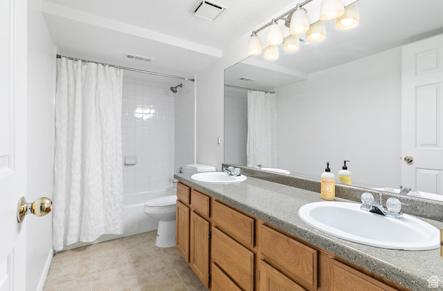 bathroom with visible vents, toilet, and a sink