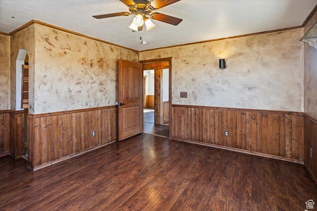 3356 W 1200 S, Ogden, UT 84404 - empty room featuring a ceiling fan, a wainscoted wall, wood finished floors, and wooden walls