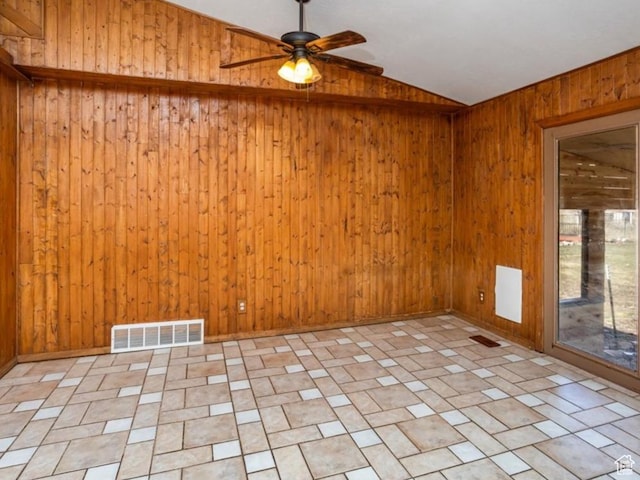 3356 W 1200 S, Ogden, UT 84404 - unfurnished room featuring wooden walls, vaulted ceiling, visible vents, and a ceiling fan
