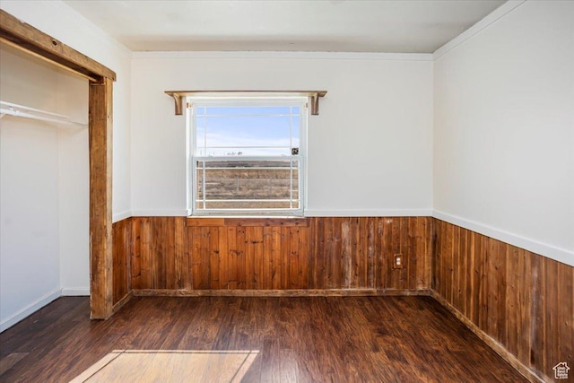 3356 W 1200 S, Ogden, UT 84404 - unfurnished bedroom featuring a wainscoted wall, dark wood-style flooring, and wood walls