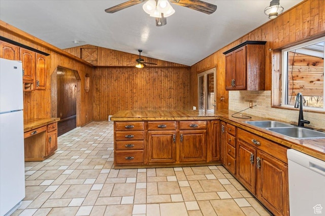 3356 W 1200 S, Ogden, UT 84404 - kitchen with a ceiling fan, a sink, brown cabinets, white appliances, and wood walls