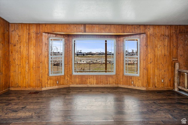 3356 W 1200 S, Ogden, UT 84404 - spare room featuring baseboards, wood walls, and wood finished floors