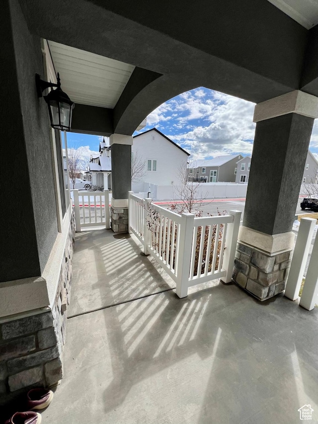 view of patio / terrace featuring a residential view and a porch