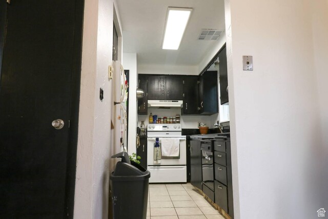 367 W 1100 N, Logan, UT 84341 - kitchen featuring white range with electric stovetop, under cabinet range hood, light tile patterned floors, dark cabinetry, and a sink