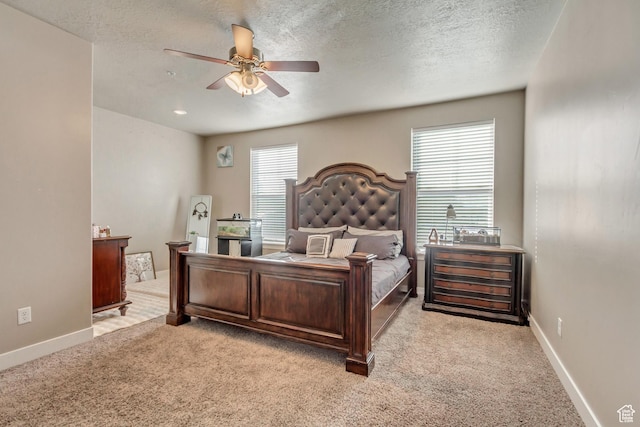 1128 S 820 E Unit 6104, Heber City, UT 84032 - bedroom featuring light colored carpet, a textured ceiling, baseboards, and a ceiling fan