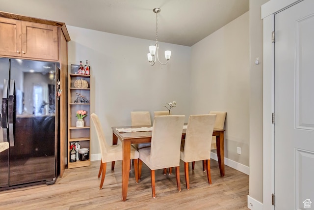 1128 S 820 E Unit 6104, Heber City, UT 84032 - dining area featuring light wood-style flooring, a notable chandelier, and baseboards