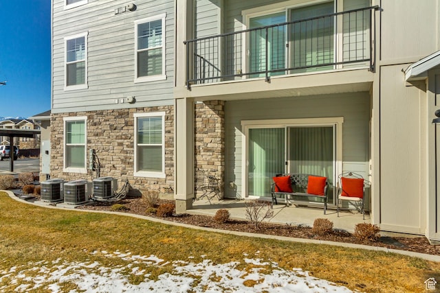 1128 S 820 E Unit 6104, Heber City, UT 84032 - rear view of house with a balcony, central AC unit, and stone siding