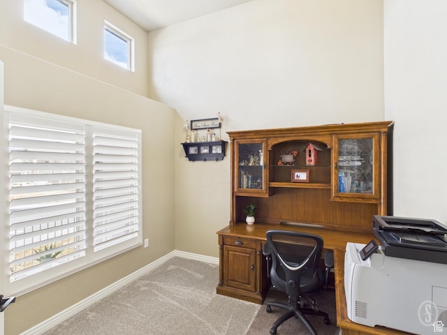 office space featuring baseboards and light carpet