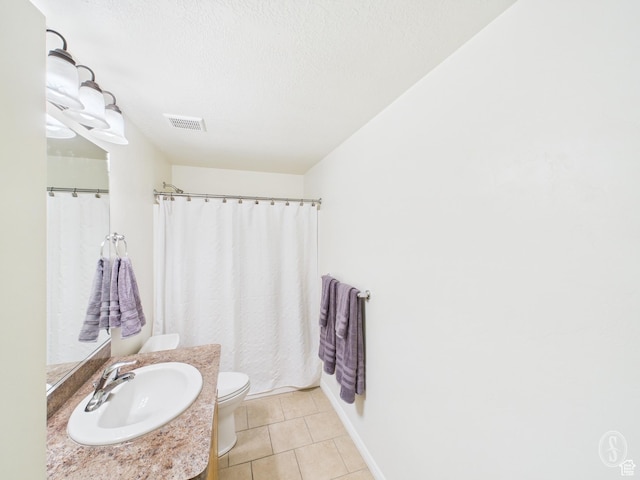 full bath with vanity, toilet, visible vents, a textured ceiling, and tile patterned flooring