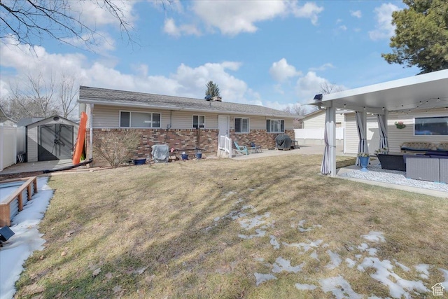 1564 N 1600 E, Logan, UT 84341 - back of house with a storage unit, brick siding, an outdoor structure, and fence