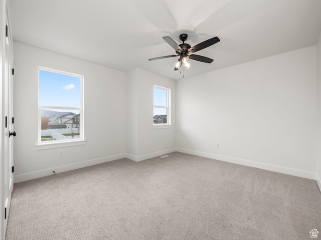 804 W 900 S, Springville, UT 84663 - spare room featuring light carpet, a ceiling fan, and baseboards