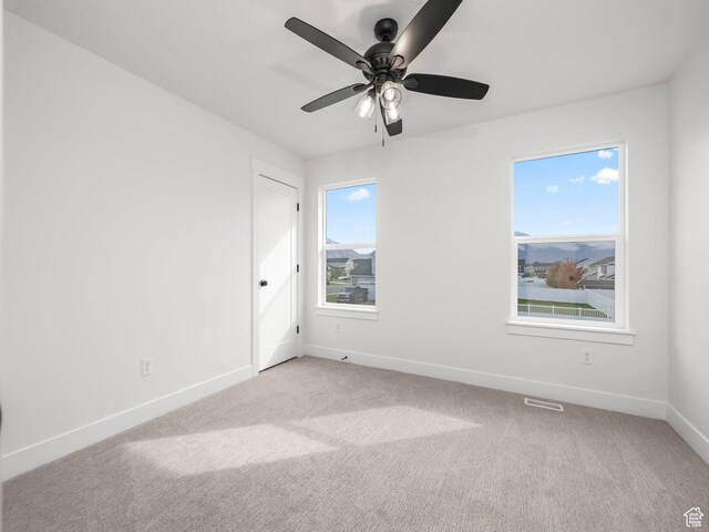 804 W 900 S, Springville, UT 84663 - carpeted empty room with baseboards, plenty of natural light, visible vents, and a ceiling fan