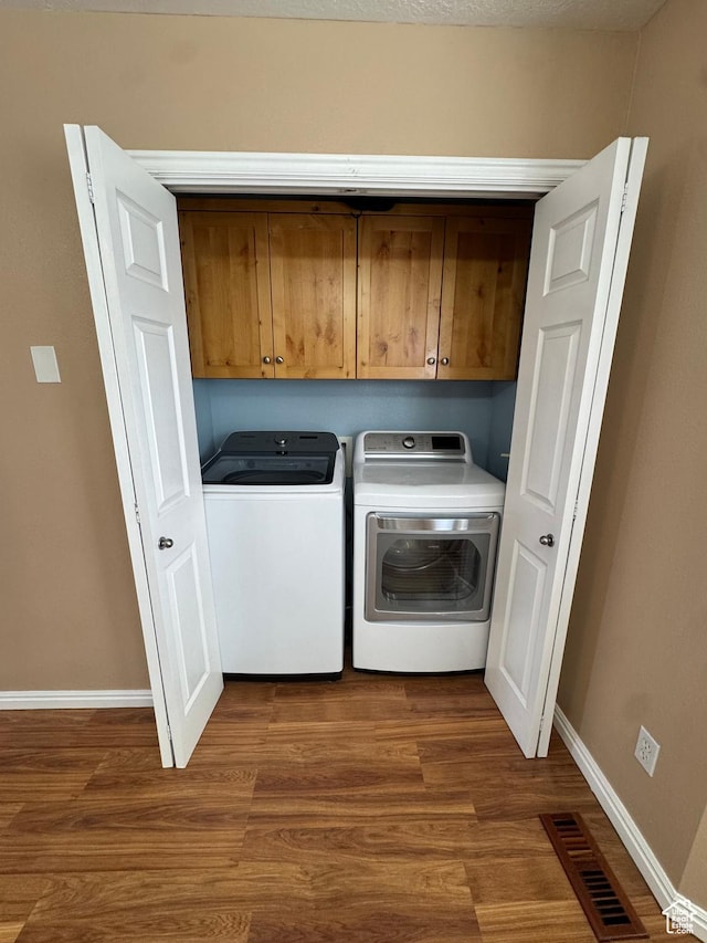 840 E 170 N, Heber City, UT 84032 - washroom featuring cabinet space, baseboards, washing machine and dryer, and dark wood-type flooring