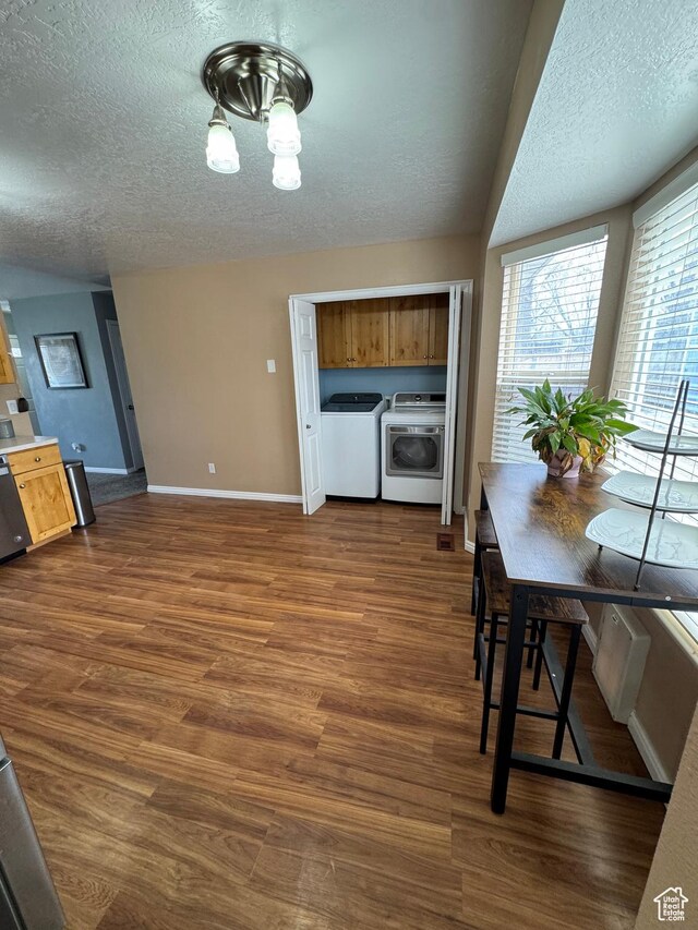 840 E 170 N, Heber City, UT 84032 - kitchen featuring independent washer and dryer, a textured ceiling, dark wood-style flooring, baseboards, and brown cabinetry