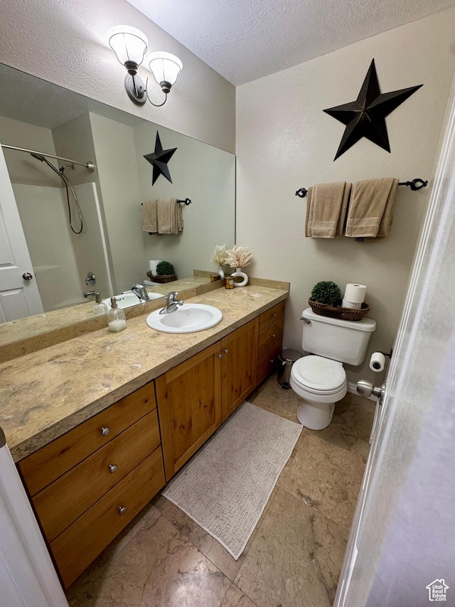 840 E 170 N, Heber City, UT 84032 - bathroom with a textured ceiling, toilet, vanity, stone finish flooring, and a shower