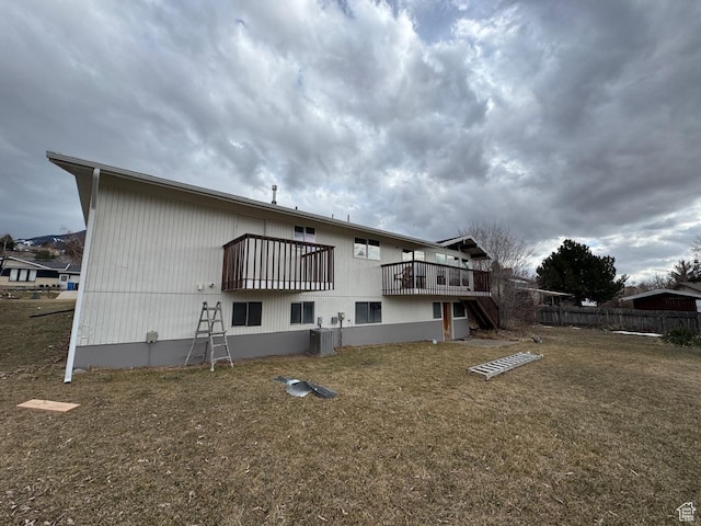 525 S 75 W, Providence, UT 84332 - back of house with central air condition unit, a yard, and fence